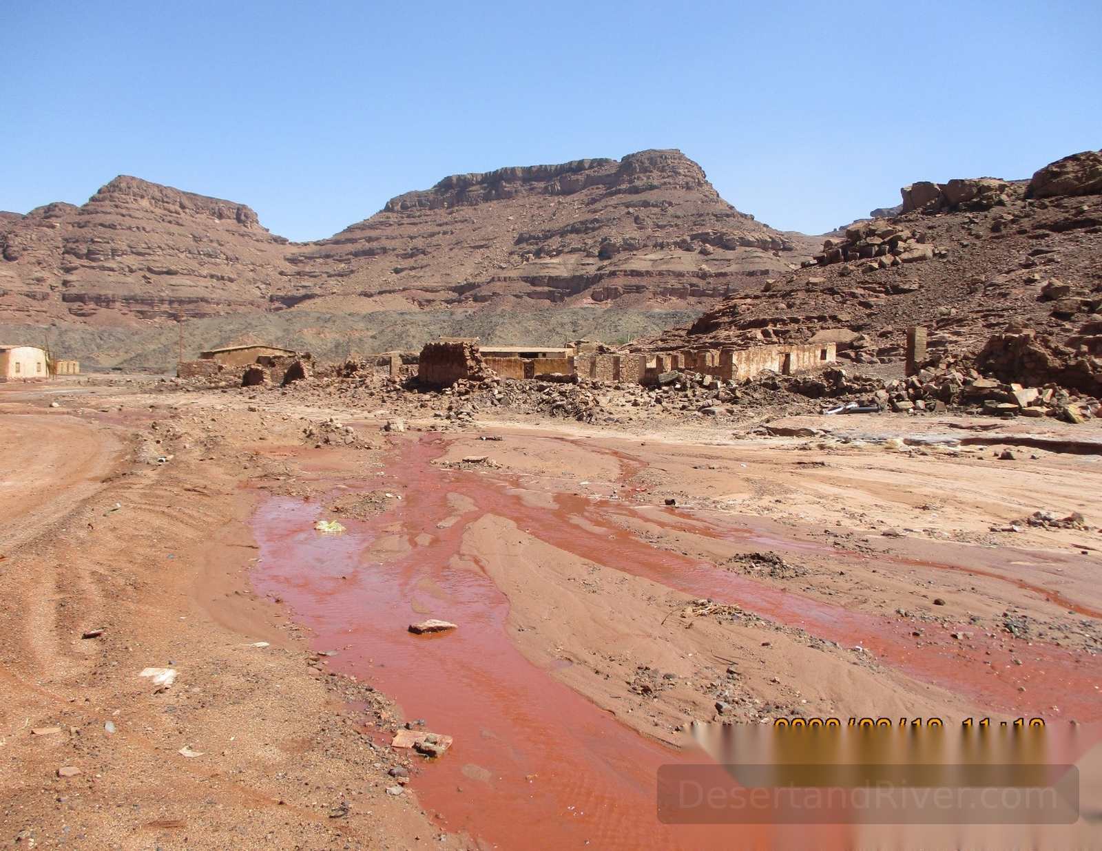 Ruins and slag-stained ground at Wadi Nasb, an ancient copper-smelting site in South Sinai, Egypt.